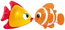 Colorful plastic toy fish in red, yellow, and orange with large eyes and fins. The fish appear to be swimming in water.