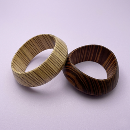 Wooden bangle bracelets, striped baroque design, brown and natural wood colors, elegant style, round shape.