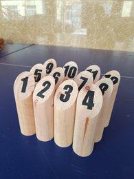  Wooden game pieces with numbers 1-4 printed on them, suitable for a Nordic-style launch game.