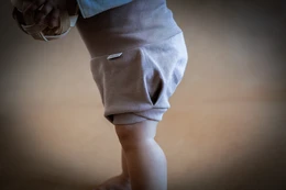  Bloomer Blueberry baby pants in ecru, light brown, dark brown, and light green colors. Available in sizes 1M, 3M, 6M, 9M, 12M, 18M, and 24M.