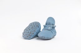 Soft, blue baby shoes with polka dot pattern and button detail. Suitable for infants aged 0-18 months.