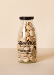  Premium organic macadamia nuts in a glass jar. Roasted with sea salt for a delicious, crunchy snack.