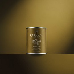 Peanut - Sesame Lemon - Mini 60g. Covered nuts product featuring a blend of peanuts, sesame seeds, and lemon flavoring. The product has a round, cylindrical shape and is packaged in a yellow metal tin.