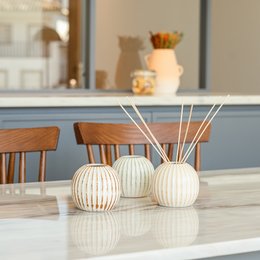 Tangerine Vase - Patine Orange, Patine Verde, Patine Terracotta. Ceramic vase with ribbed texture, available in three color variants.