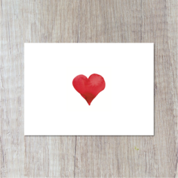 A red heart-shaped postcard for love and romance.