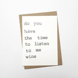 A greeting card with the text "do you have the time to listen to me wine" printed on it.