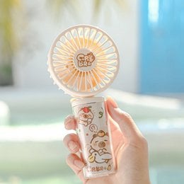 Portable fan with Capybara design, featuring a round shape, white color, and a fan-like structure.