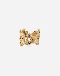Gold statement ring with abstract floral design