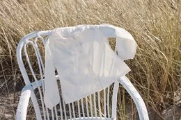 White baby shirt with cloud design, made of soft cotton material, suitable for casual wear.