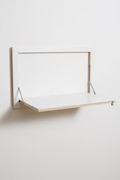 White wall-mounted desk/secretary with minimalist design and wooden frame.