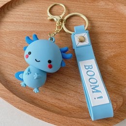 Cute and colorful Axolotl-shaped keychains in blue, purple, and pink. The keychains feature a plush Axolotl figure and a rectangular charm with the text "Booi".