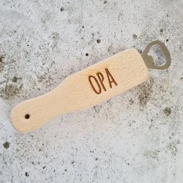 Wooden bottle opener with "OPA" text, suitable for kids.