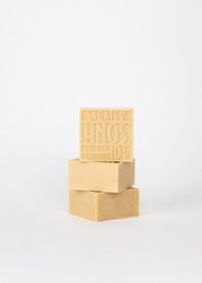  Lily soap bar, 125g. Rectangular soap bars made of natural ingredients. Pale yellow color with embossed text on the surface.