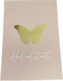 A gold foil greeting card with a vibrant yellow butterfly design and the text "Hello sweet startle" printed on the front.