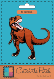 A brown dinosaur brooch with an open mouth and sharp teeth. The brooch has a classic dinosaur shape and design, suitable for adding a touch of prehistoric style to any outfit.