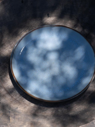 Evora dinner plate in a light blue color with a simple, minimalist design.