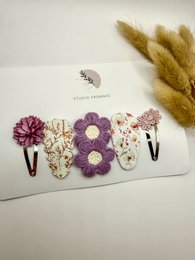 Set of 4 colorful floral hair clips in gold and silver tones, perfect for spring and summer accessorizing.
