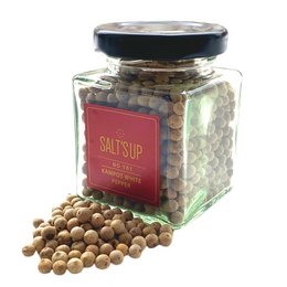 White peppercorns in a glass jar labeled "KAMPOT WHITE pepper". The peppercorns have a light, creamy color and a distinctive flavor.