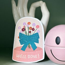 "Congratulations card with a bouquet of flowers and the text 'Well done!'"