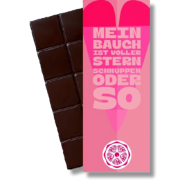  Dark chocolate bar with "Mein Bauch ist voller Sterne" (My belly is full of stars) text on the pink packaging.