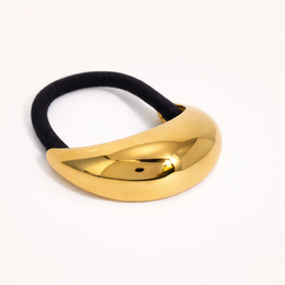  Black hair tie with gold metallic curved accent, elegant minimalist design for ponytails and buns.