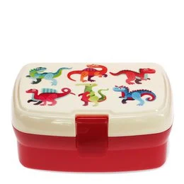 Rectangular red and white lunch box with a graphic design featuring colorful cartoon dinosaurs. The lunch box has a tray inside and is suitable for children's meals or snacks.