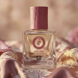 Rose Desire Damascus Eau de Parfum is a floral, feminine fragrance with notes of rose, jasmine, and amber. The perfume is presented in a glass bottle with a pink cap.