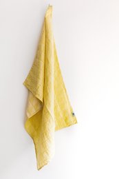 A yellow, textured tea towel with a simple, minimalist design. The towel appears to be made of a soft, absorbent material and would be suitable for drying dishes or hands in a kitchen setting.