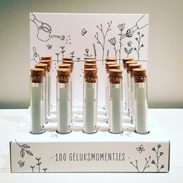 Assortment of 100 moments of happiness (40 pieces) + FREE display. This product contains a set of 40 glass vials filled with various seeds, herbs, and other natural elements, presented in a decorative display box.