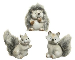  A set of 3 gray and white plush squirrel figurines. The squirrels have fluffy fur, round bodies, and bushy tails. They appear to be decorative objects or collectibles.