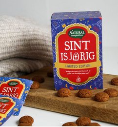 "Natural Sint Isjorig tea, limited edition, with festive holiday design on packaging"