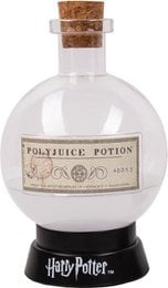 A large, round glass bottle with a cork stopper, containing a purple liquid. The bottle is labeled "Potion" and has a Harry Potter theme, with a wooden base and glowing lights around it, creating a magical and mystical atmosphere.