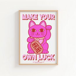  Vibrant pink poster featuring a neon-style illustration of a Maneki-neko (lucky cat) with the text "Make Your Own Luck". The poster has a bold, eye-catching design that would be suitable for display in a home, office, or retail setting.