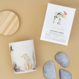 Soothing tundra-scented soy wax candle with a nature-inspired design featuring a moose. The candle is made from sustainable soy wax and has a long-lasting burn time.