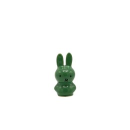  Green ceramic figurine of a rabbit or bunny with a simple, minimalist design.