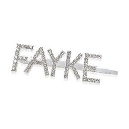 Rhinestone-embellished hair clip in the word "FAYKE" design, suitable for adding a touch of sparkle to any hairstyle.