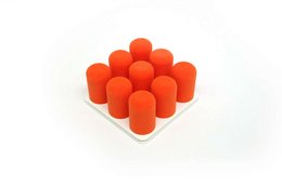 A set of 9 bright orange rubber cones or pins arranged in a grid pattern. The cones appear to be made of a soft, flexible material and are likely used for sports or training purposes.