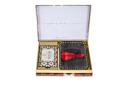  Rectangular gift box containing assorted soap bars in various geometric patterns and colors, including red, black, and white.
