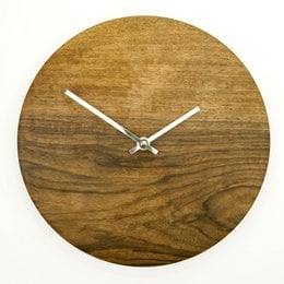 Minimal round wall clock in oak, walnut, or black walnut wood finishes. Available in small and large sizes.